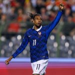 Michael Olise celebrates after scoring France’s late winner against Belgium