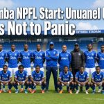 Enyimba FC players and coaches posing for a team photo on the pitch in blue kits ahead of the NPFL season