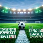 A wide-angle, low-perspective view of a soccer ball centered on a white line of a large, modern stadium pitch at night. Text overlays at the bottom left read 'NIGERIA FOOTBALL NEWS NPFL', and at the bottom right, 'SUPER EAGLES LATEST UPDATES' with the NFF logo and an eagle graphic. Floodlights illuminate the empty stadium