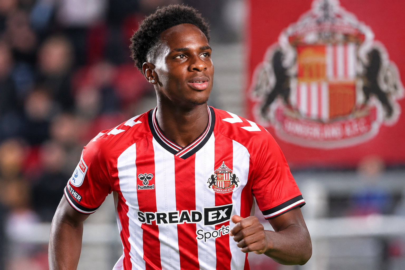 Trey Ogunsuyi in a Sunderland shirt during his football development