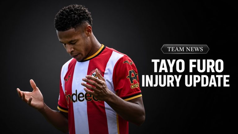 Tayo Furo looking down in Brentford kit during injury update